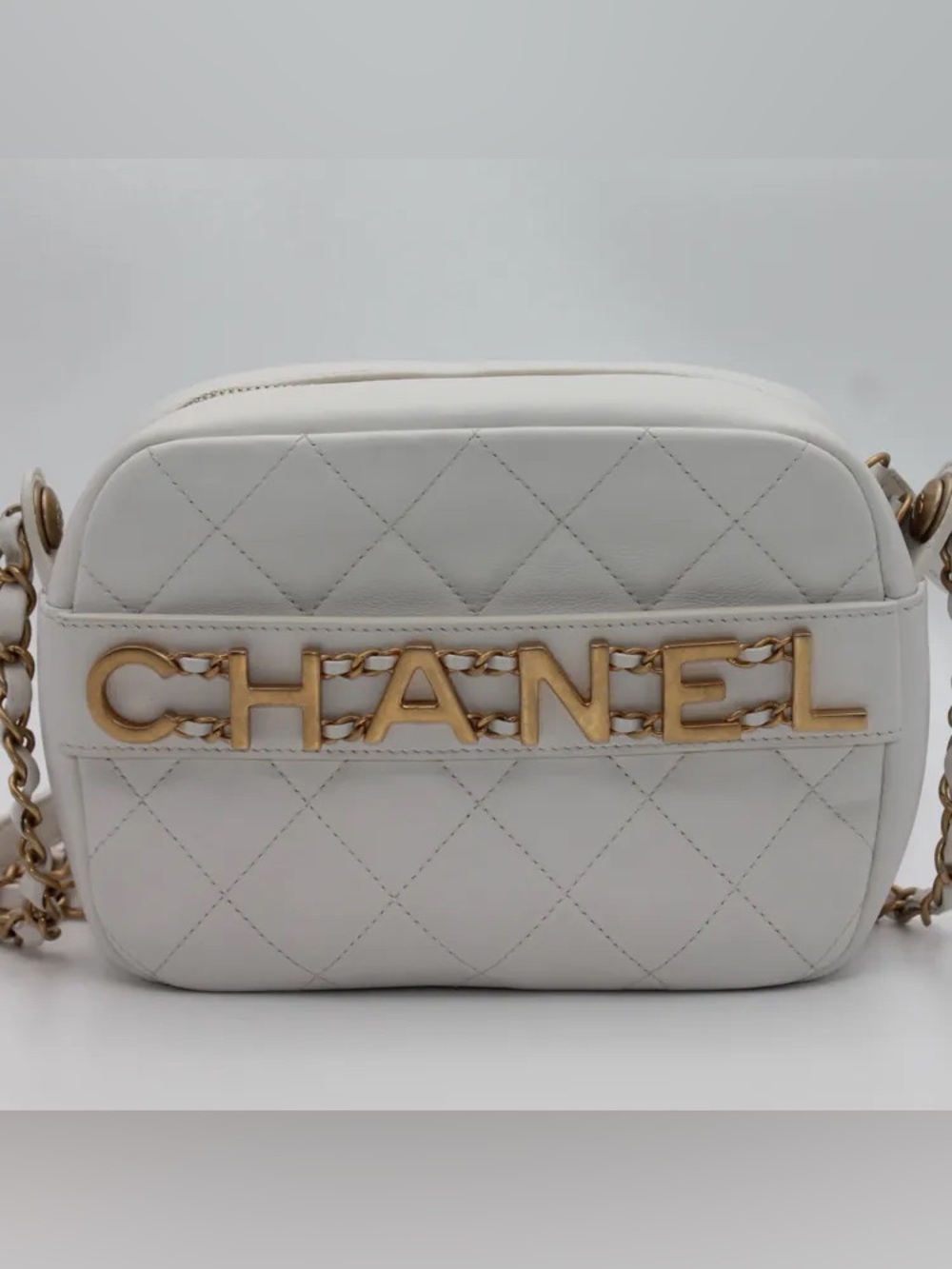 CHANEL White Quilted Crossbody Bag with Gold Lettering and Chain